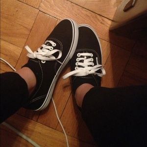 Black and white low top vans
