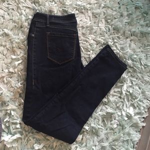 Dark wash skinny jeans with heavy stitching