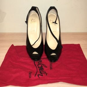 Gently worn peep toe Louboutin ankle strap pump.