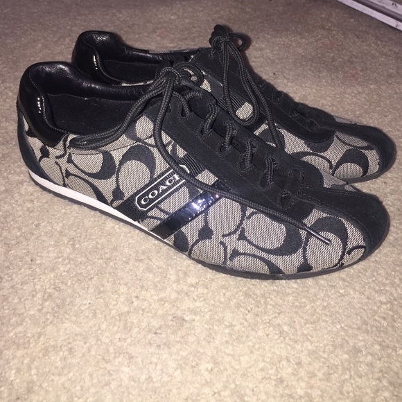 Black and grey Coach sneakers.