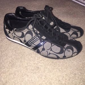 Black and grey Coach sneakers.