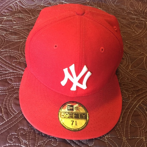 Red NY hat with white NY symbol