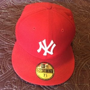 Red NY hat with white NY symbol