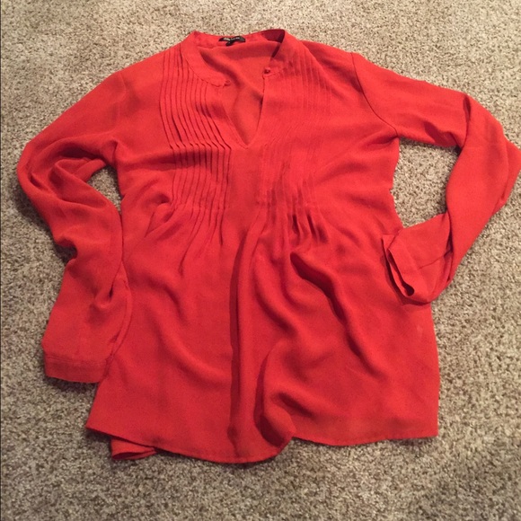 Orange chiffon blouse.