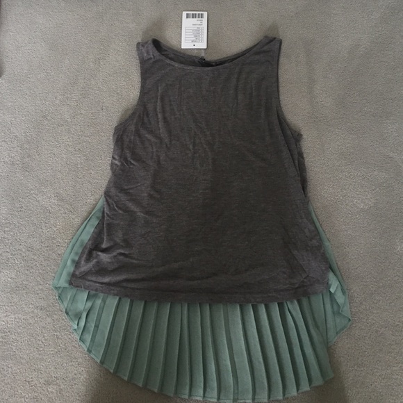Fun gray tank top with green pleats.