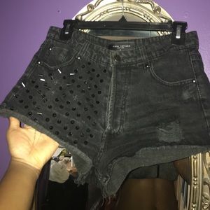 Black High waste shorts with spikes.