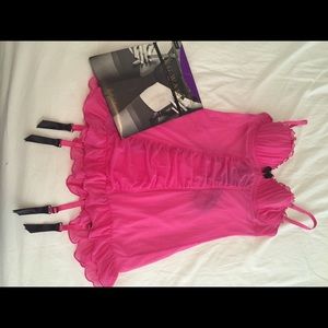 Pink fitted lingerie with black stockings