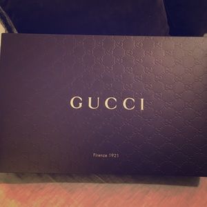 Gucci box, tissue, and string
