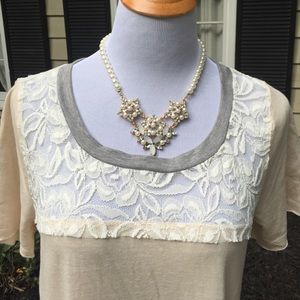 tunic with lace and gray trim.