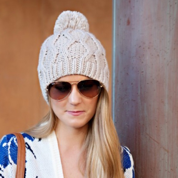 Cream beanie with poof ball on top