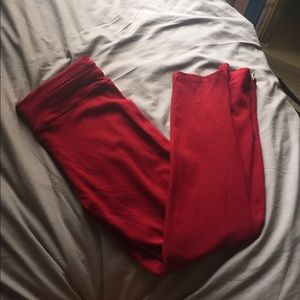 Burgundy skinny pants.