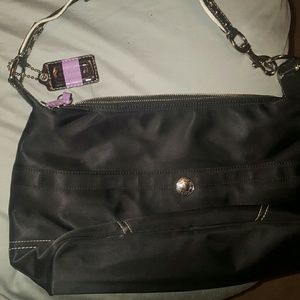 Coach shoulder bag with purple tags and inside