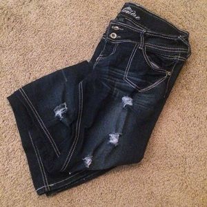 Shredded jeans skinny and boot