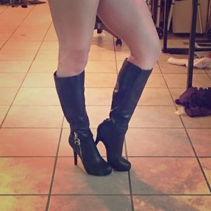 Faux leather black high length boot.