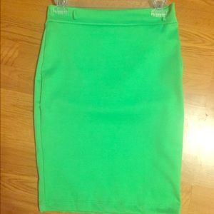 Fitted lime green pencil skirt .