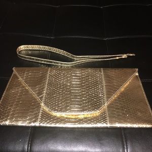 Gold snake print envelope clutch