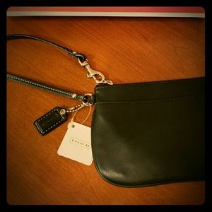 Black leather Coach wristlet w/blue satin lining