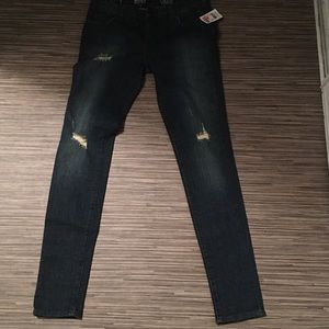 Vans distressed jeans.