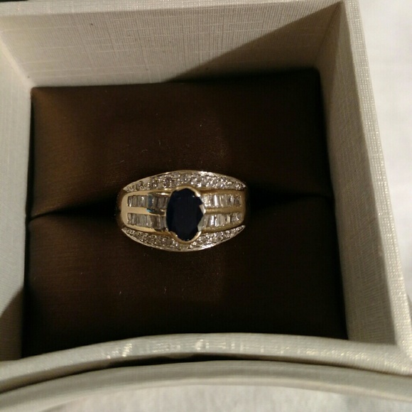 Blue sapphire and channel diamond ring