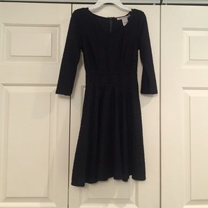 Black dress with lace cut out along middle