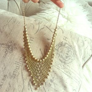 Gold bib necklace purchased from smu