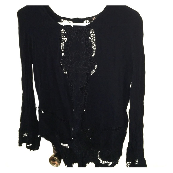 Long sleeve black top with intricate stitching
