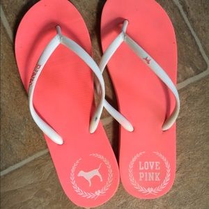 Large pink flip flops