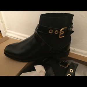 Black booties with gold buckle