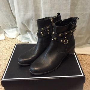 Black booties with gold detailing