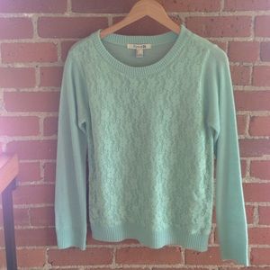 A light blue sweater