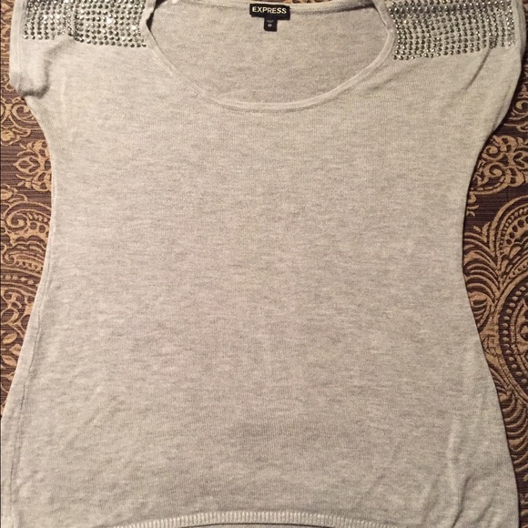 Women's XS sweater studs on shoulders.