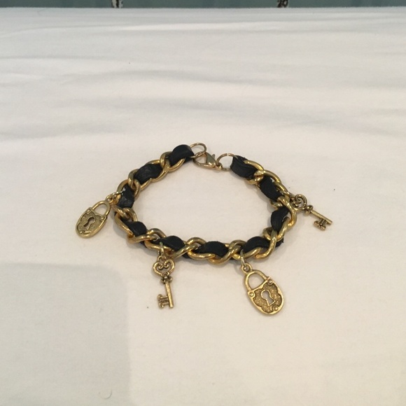 Black leather and gold key and lock bracelet