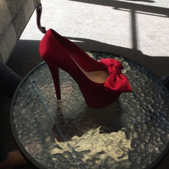 Red satin peeptoe pumps