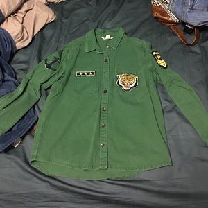 Green jacket with decorative badges