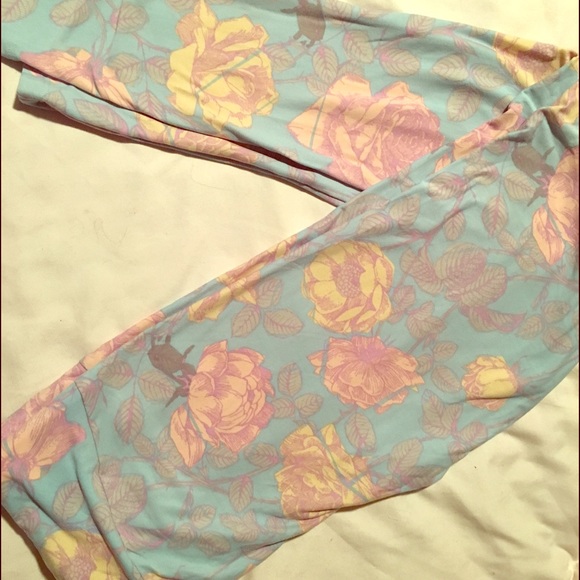 Lularoe TC Rose legging with a blue background New