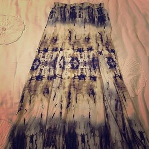 Long maxi skirt. Cut on both sides, shows legs.