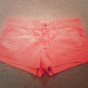 Hot orange shorts.