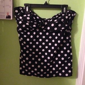 Black and white polka dot bathing suit top.