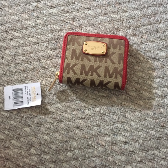 Michael Kors wallet.. With red accents.