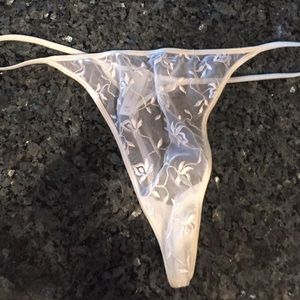 White see-thru embroidery decorated thong.