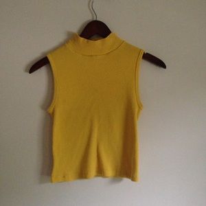Yellow cropped turtleneck tank top.