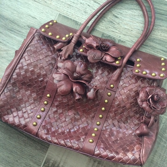Woven wine colored floral handbag