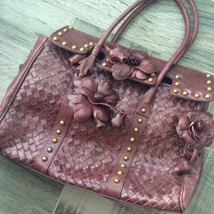 Woven wine colored floral handbag