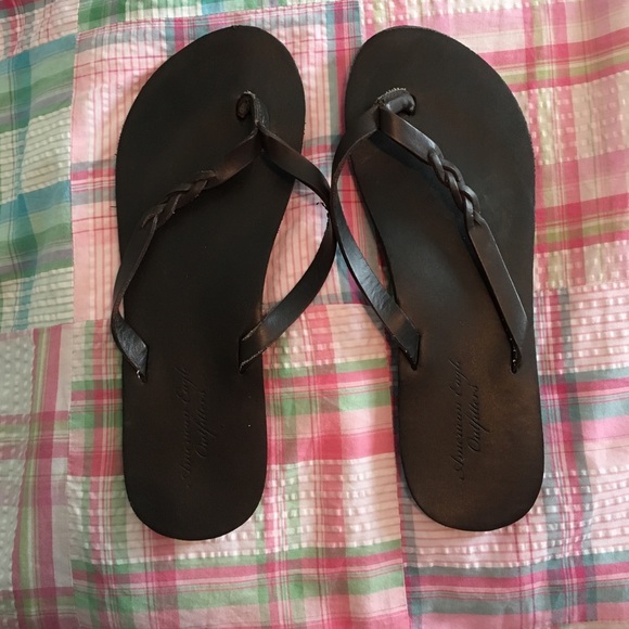 Dark brown flip flops