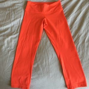 Bright coral Lululemon wunder under crops