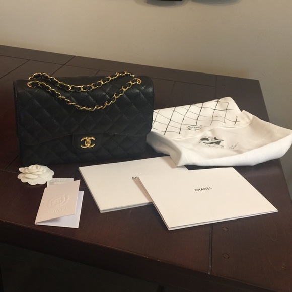 CHANEL Handbags - 100% Auth. Chanel Black Jumbo Classic Flap w/ Gold