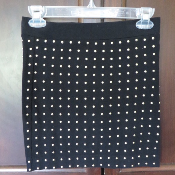Black pencil skirt with gold round studs