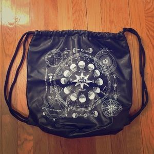 Black, faux leather constellation print backpack.