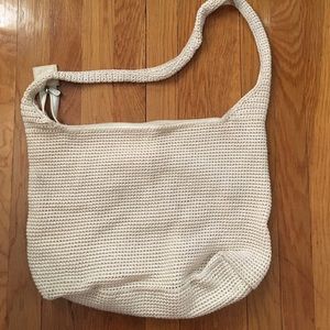 Beige, woven shoulder bag.