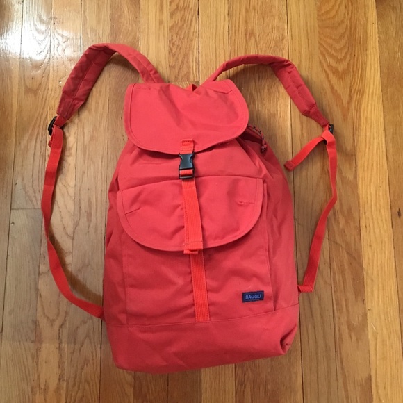 Bright coral/orange BAGGU backpack.